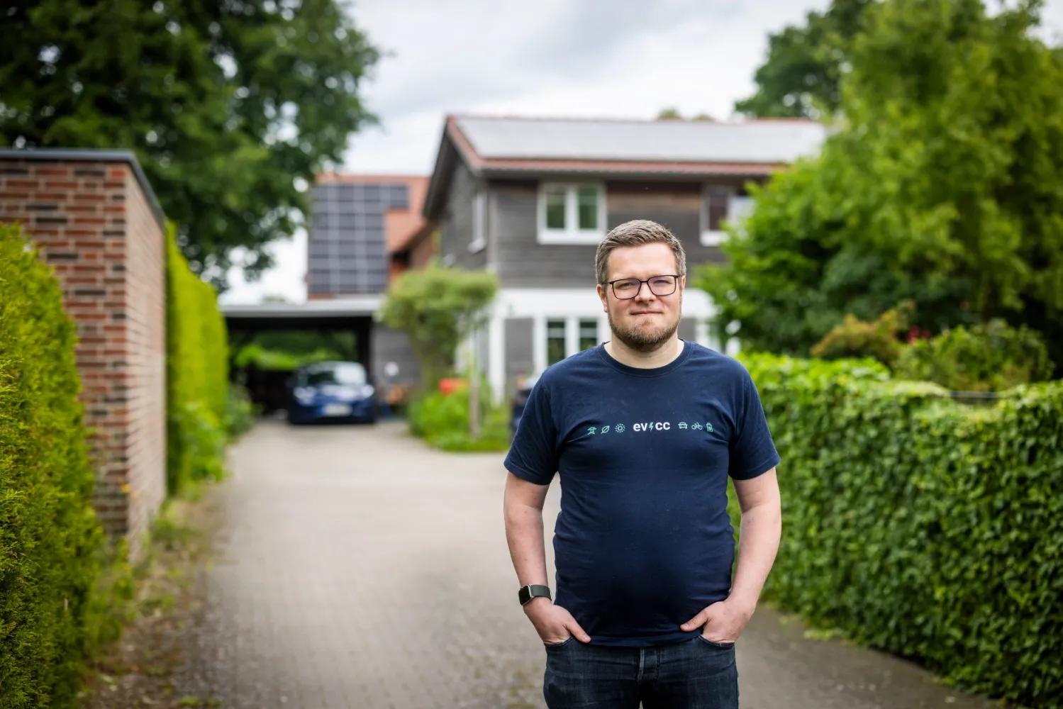 Michael in front of house