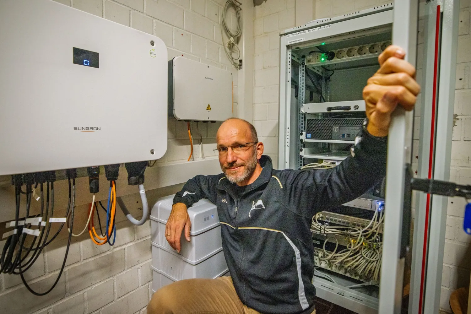 Michael with Sungrow inverter and battery
